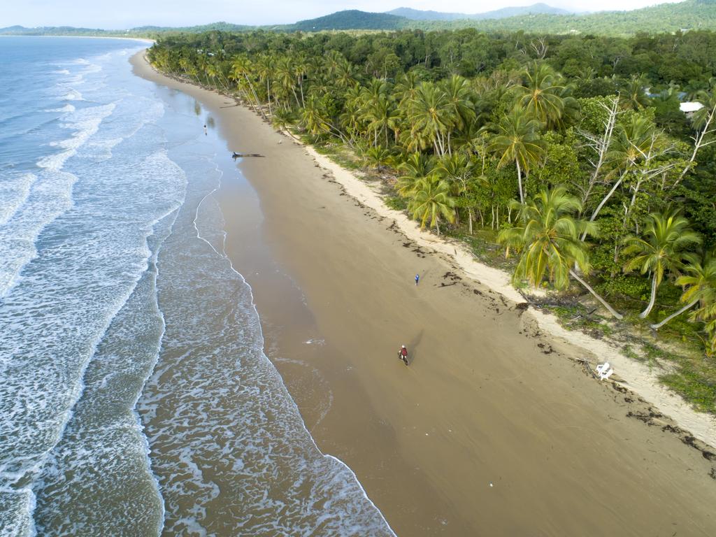 The palm-fringed beach has 14km of soft sands. Picture: Tourism Tropical North Queensland