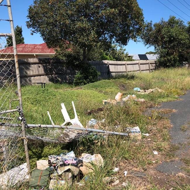 Dumpers smashed a barbed wire fence to dump waste.