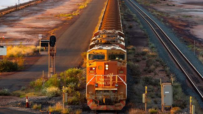 A BHP freight train carrying Australian iron ore to port. Australia ships around a third of its overall exports to China. Picture: Ian Waldie/Bloomberg News