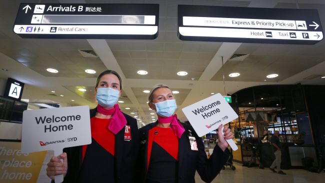 Qantas staff prepare to welcome travellers home at Sydney's International Airport on November 1, 2021. Picture: Getty Images