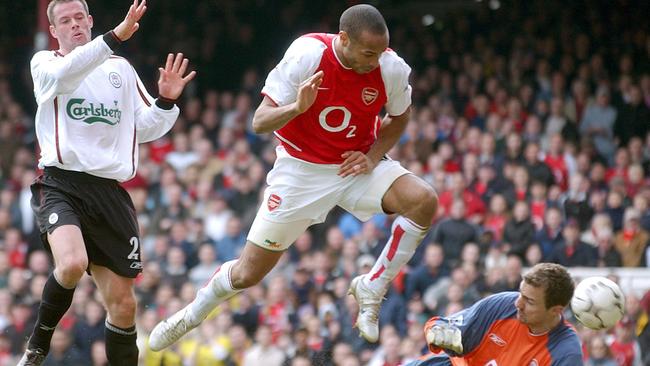 Thierry Henry scores on his way to a hat-trick against Liverpool in 2004.