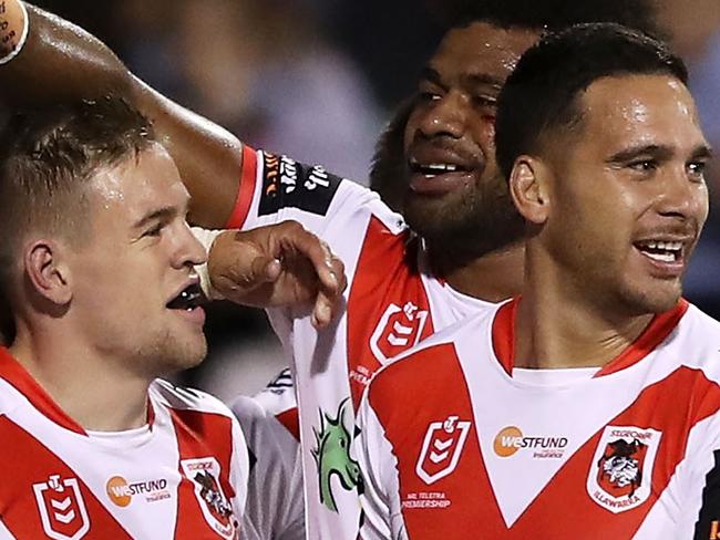 WOLLONGONG, AUSTRALIA - APRIL 20: Matt Dufty of the Dragons celebrates with his team mates after scoring a try during the round 6 NRL match between the Dragons and the Sea Eagles at WIN Stadium on April 20, 2019 in Wollongong, Australia. (Photo by Mark Kolbe/Getty Images)