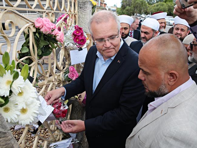 Scott Morrison looks at the memorial tributes outside Lakemba Mosque. Picture: Adam Yip