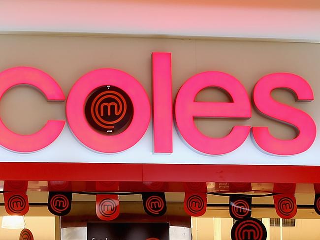 MELBOURNE, AUSTRALIA - MAY 25: A shopper walks out of Coles supermarket on May 25, 2015 in Melbourne, Australia. In a bid to regain its title as Australia's distinguished retailer, Woolworths are set to cut costs and reduce prices on thousands of grocery products to compete with rival supermarket giants Coles and Aldi. (Photo by Quinn Rooney/Getty Images)