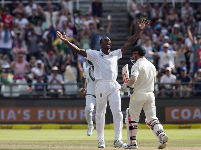 Kagiso Rabada of South Africa celebrates the wicket of David Warner.