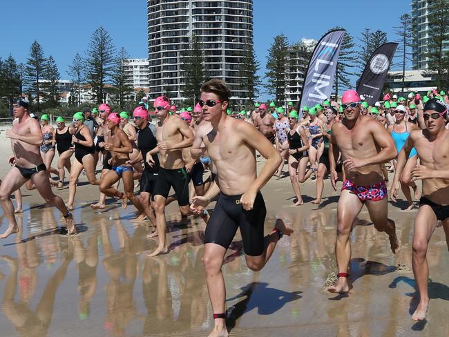 Pictured Leaving coolangatta and Arriving at Kirra  participants in the anual Cooly Classic 1000m open age, a  World Series ocean swim with competitors from around the world and Australia .  Pic Mike Batterham