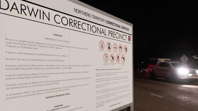 Emergency service vehicles arrive at the Darwin Correctional Facility after prisoners were reported on the roof after a mass breakout. Picture: Che Chorley