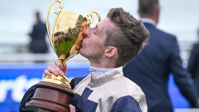 Harry Coffey kisses the Caulfield Cup after his win with Duke De Sessa. Picture: Reg Ryan/Racing Photos via Getty Images