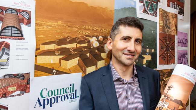 Giuseppe Calabrese stands in front of his winning plans for the Mars City Design Urban Farming Challenge 2020. Picture: Craig Peihopa