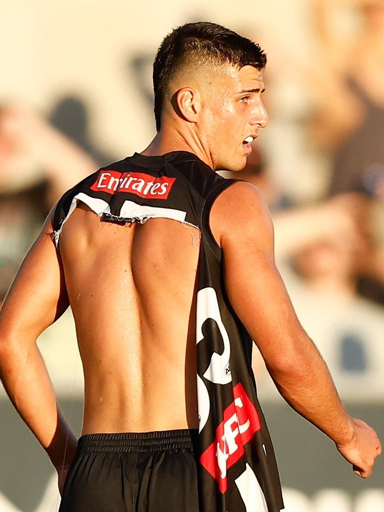 Nick Daicos of the Magpies looks on with a torn jumper. (Photo by Michael Willson/AFL Photos via Getty Images)