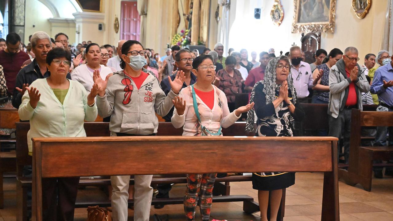 Catholic faithful pray during a mass for the healing of Pope Francis at San Miguel Arcangel Cathedral in Tegucigalpa on February 23, 2025. Picture: AFP.