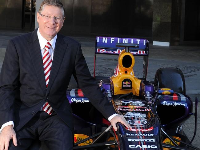MELBOURNE, AUSTRALIA - AUGUST 03: Premier of Victoria, the Hon Dr Denis Napthine poses next to an Infiniti Red Bull Racing Formula One car during an AGPC media announcement at the State Government Office on August 3, 2014 in Melbourne, Australia. (Photo by Vince Caligiuri/Getty Images)