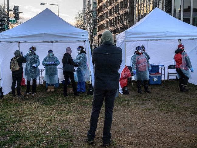 The day before Christmas, Americans are facing long lines to get tested for the coronavirus amid a new surge driven by the Omicron variant and a dire shortage of testing options. Picture: AFP