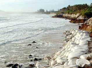 Sand bags being used to hold back the tide of coastal erosion at The Belongil in Byron Bay.