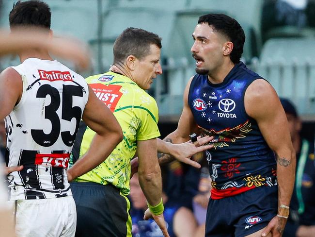 MELBOURNE, AUSTRALIA - MAY 18: Izak Rankine of the Crows disputes an umpiring decision in the dying seconds during the 2024 AFL Round 10 match between The Collingwood Magpies and Kuwarna (Adelaide Crows) at The Melbourne Cricket Ground on May 18, 2024 in Melbourne, Australia. (Photo by Dylan Burns/AFL Photos via Getty Images)