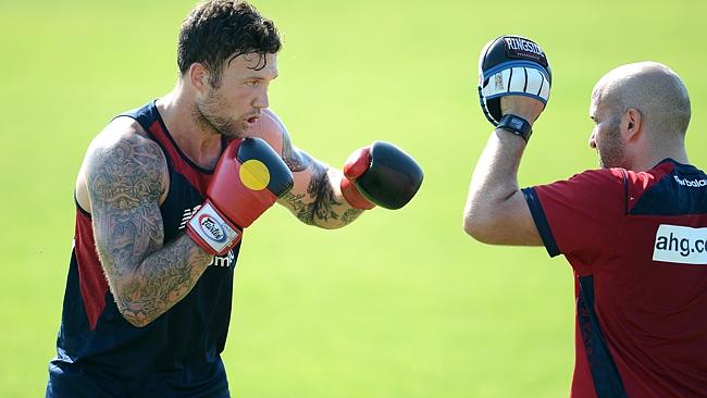 Mitch Clark works on his boxing skills during Melbourne's heatwave.