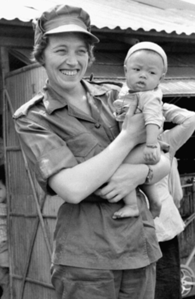 Then Lieutenant Margaret Ahern with a Vietnamese child. Picture: Australian War Memorial