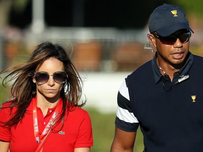 JERSEY CITY, NJ - SEPTEMBER 28: Captain's assistant Tiger Woods of the U.S. Team walks with Erica Herman during Thursday foursome matches of the Presidents Cup at Liberty National Golf Club on September 28, 2017 in Jersey City, New Jersey.   Rob Carr/Getty Images/AFP == FOR NEWSPAPERS, INTERNET, TELCOS & TELEVISION USE ONLY ==