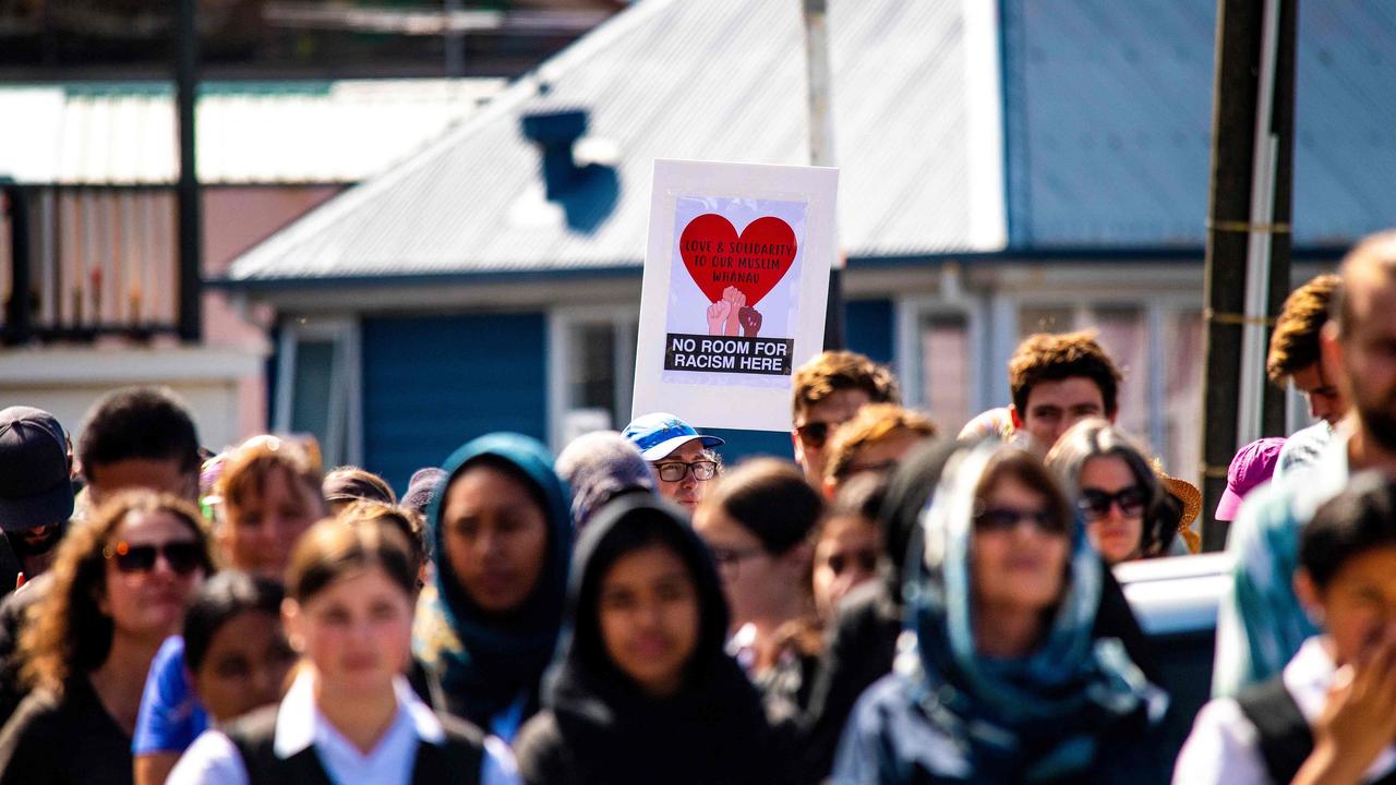 People observe two minutes of silence for the victims of the twin mosque massacre in Christchurch at the Wellington Islamic Centre on March 22. Picture: Dave Lintott/AFP.