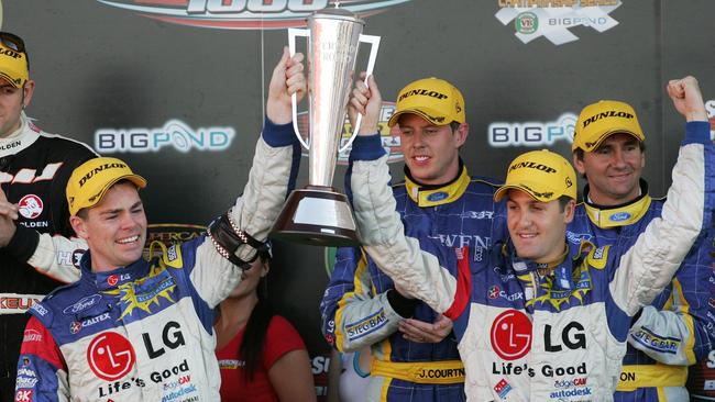 Craig Lowndes and Jamie Whincup celebrate the first of their three consecutive Bathurst 1000 crowns together in 2006.