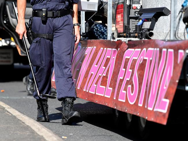 NSW Police check vehicles for security as participants prepare to take part in the 40th annual Gay and Lesbian Mardi Gras parade in Sydney. Picture: AAP Image/Joel Carrett