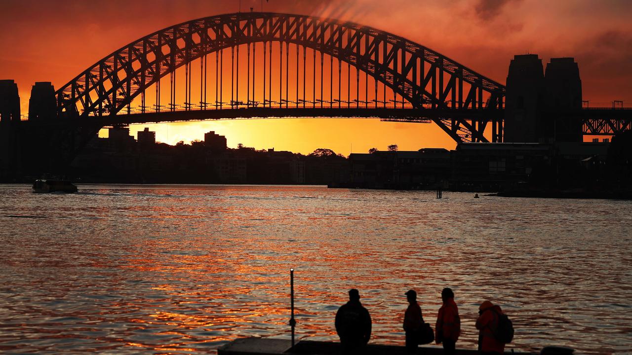 Sunrise over the Sydney Harbour Bridge, pictured from Looks Avenue in Balmain. Picture: Rohan Kelly