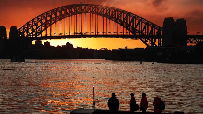 Sunrise over the Sydney Harbour Bridge, pictured from Looks Avenue in Balmain. Picture: Rohan Kelly