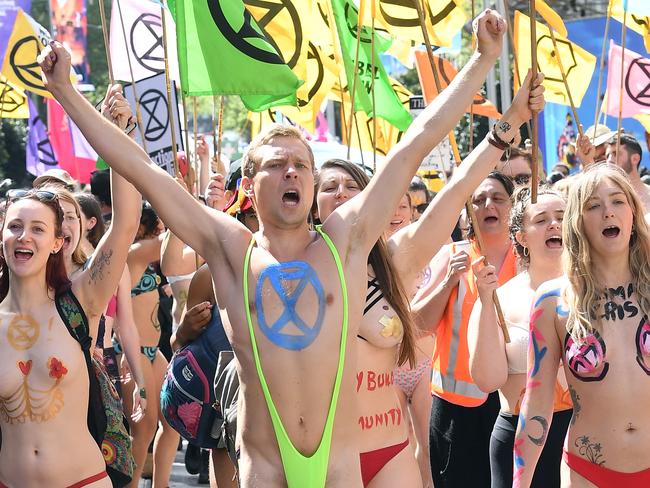 Activists from Extinction Rebellion participate in a protest in Melbourne, Saturday, October 12, 2019. The Extinction Rebellion climate protests movement has planned a "spring rebellion" from Monday to Sunday, including marches aimed at blocking traffic. (AAP Image/Julian Smith) NO ARCHIVING