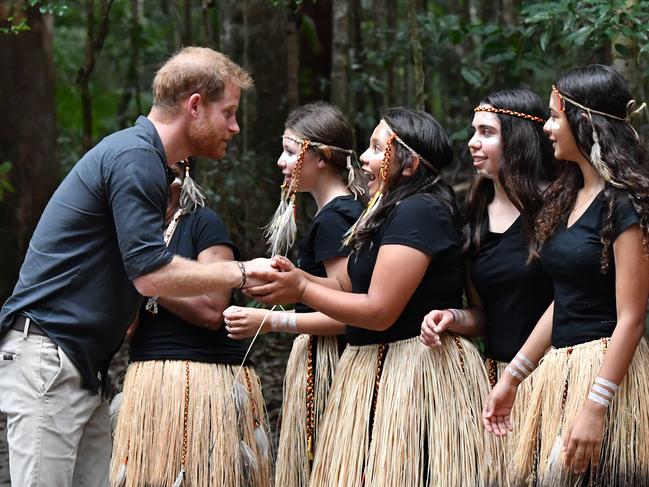 Prince Harry with members of the Butchulla people, who are the traditional owners of Fraser Island. Picture: AAP/Darren England