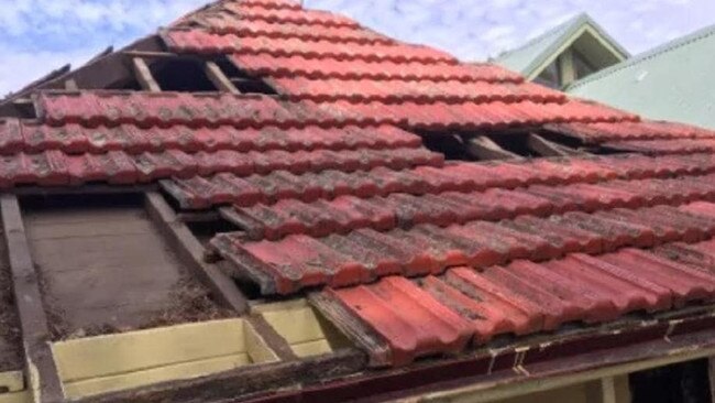 Burwood police arrested the pair following an investigation into a spate of roof repair scams in the inner west.