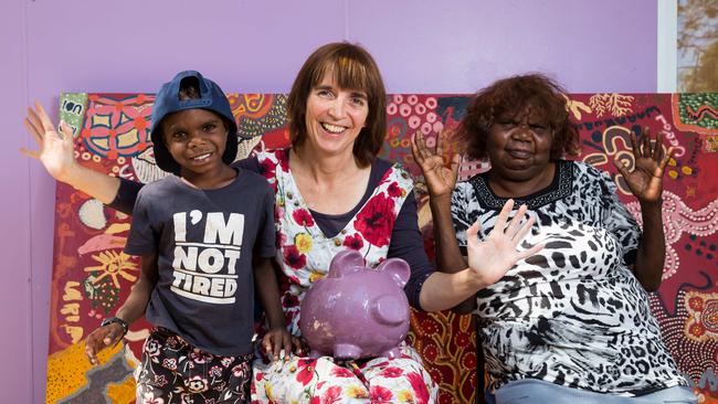 Jebediah Collins, Purple House CEO Sarah Brown, and patient Ivy Smith with the purple piggy bank. Picture: Emma Murray