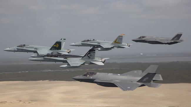 RAAF F/A-18s and F-35A Joint Strike Fighters over Stockton Beach, NSW.