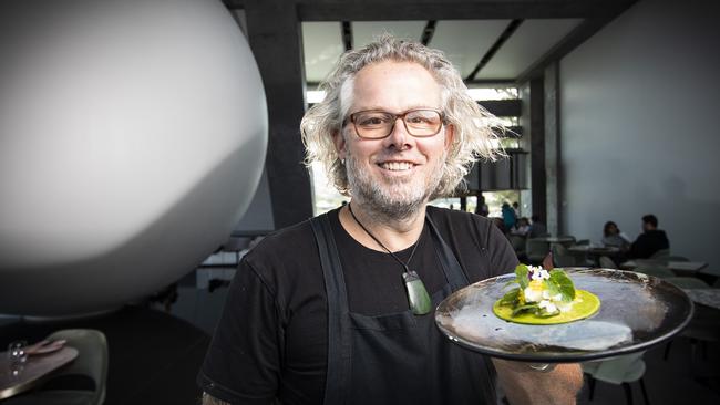 Executive chef of Mona Vince Trim pictured at Faro restaurant with a scallop taco and black margarita with pig's eye. Picture: LUKE BOWDEN