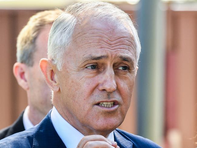 Australian Prime Minister Malcolm Turnbull (centre) speaks to the media during a visit to the Teenie Weenies Learning Centre in Panania with Minister for Women Kelly O'Dwyer (right) and Assistant Minister for Finance David Coleman (obscured) in Sydney, Monday, April 9, 2018. (AAP Image/Brendan Esposito) NO ARCHIVING