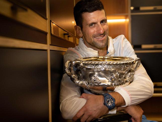 TOPSHOT - This handout picture released by Tennis Australia on January 30, 2023, shows Serbia's Novak Djokovic poses with the 2023 Australian Open men's singles final trophy at the locker room in Melbourne. (Photo by FIONA HAMILTON / TENNIS AUSTRALIA / AFP) / RESTRICTED TO EDITORIAL USE - MANDATORY CREDIT "AFP PHOTO / TENNIS AUSTRALIA / FIONA HAMILTON " - NO MARKETING NO ADVERTISING CAMPAIGNS - DISTRIBUTED AS A SERVICE TO CLIENTS