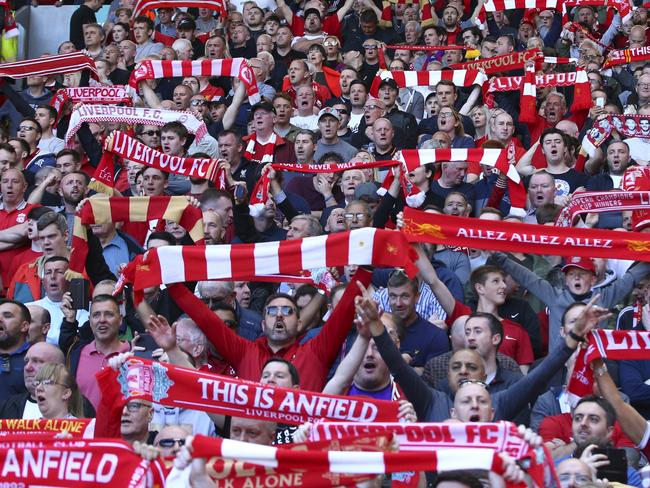 Liverpool supporters cheer prior to the English Premier League soccer match between Liverpool and Wolverhampton Wanderers at the Anfield stadium in Liverpool, England, Sunday, May 12, 2019. (AP Photo/Dave Thompson)