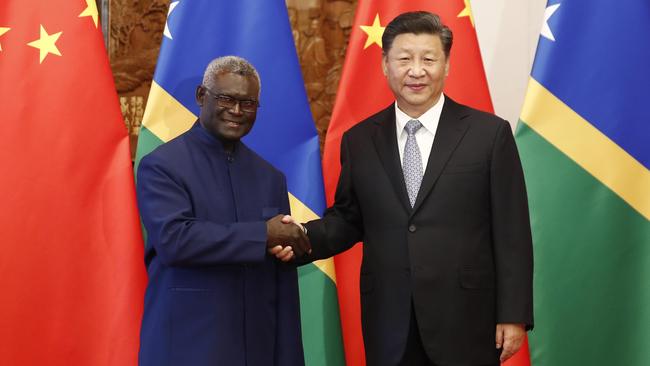 Solomon Islands Prime Minister Manasseh Sogavare greets Chinese President Xi Jinping in Beijing in early October. Picture: Getty Images