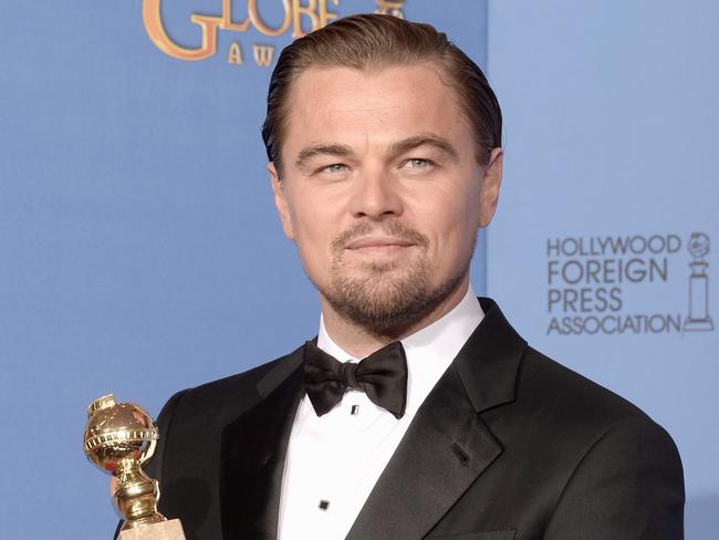 Leonardo DiCaprio with his 2014 Best Actor Golden Globe Award.