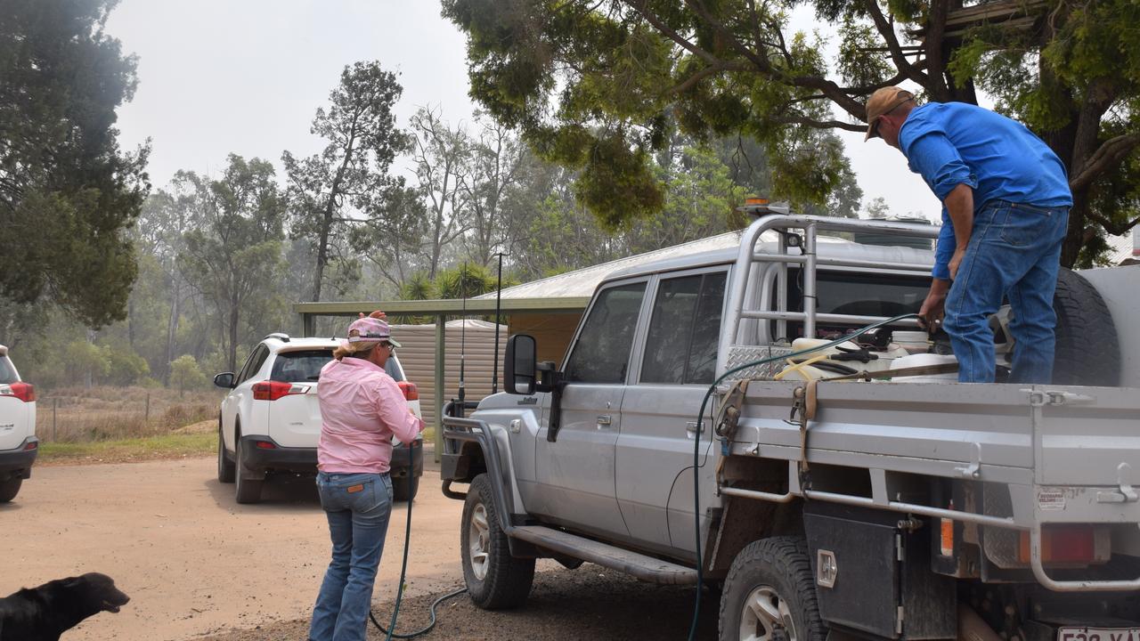 The Simpkins family prepare for another night of battling fires that have already damaged more than 100 acres of their grazing land after dry lightning struck. Picture: Emily Devon