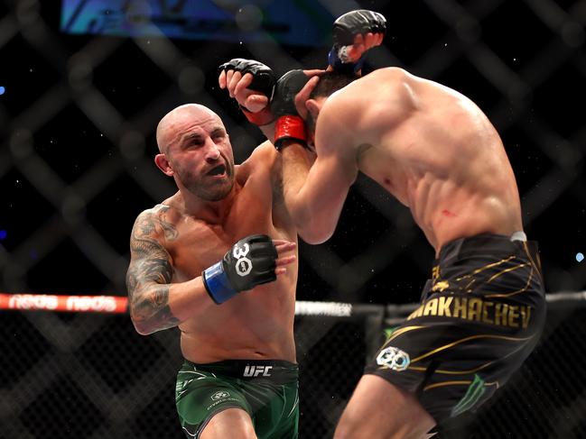 PERTH, AUSTRALIA - FEBRUARY 12: Alex Volkanovski of Australia battles Islam Makhachev of Russia in the UFC lightweight championship fight during UFC 284 at RAC Arena on February 12, 2023 in Perth, Australia. (Photo by Paul Kane/Getty Images)