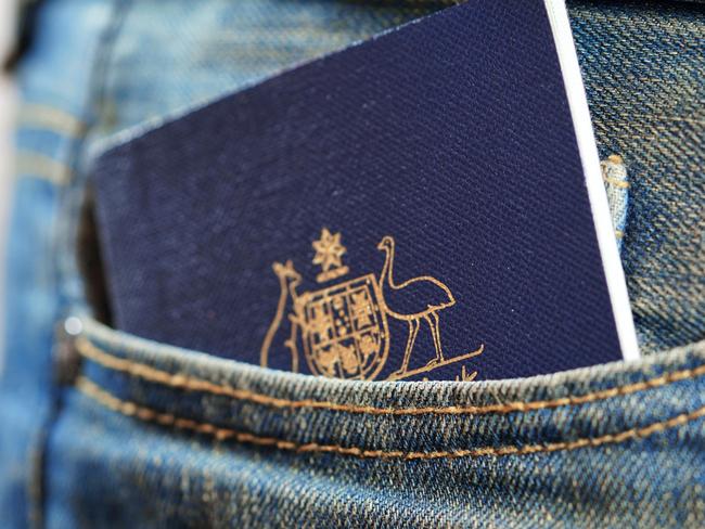 ESCAPE: Australian passport in mans jeans pocket, close up. Picture: Istock