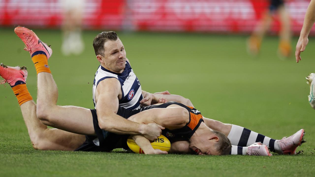 Sam Walsh gets tackled into the turf by Patrick Dangerfield during the first quarter. Photo: Michael Klein