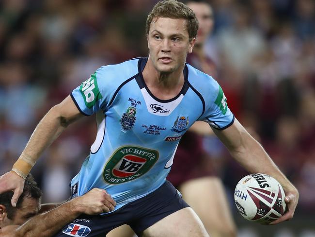 BRISBANE, AUSTRALIA - JUNE 22: Matt Moylan of the Blues is tackled during game two of the State Of Origin series between the Queensland Maroons and the New South Wales Blues at Suncorp Stadium on June 22, 2016 in Brisbane, Australia. (Photo by Mark Kolbe/Getty Images)