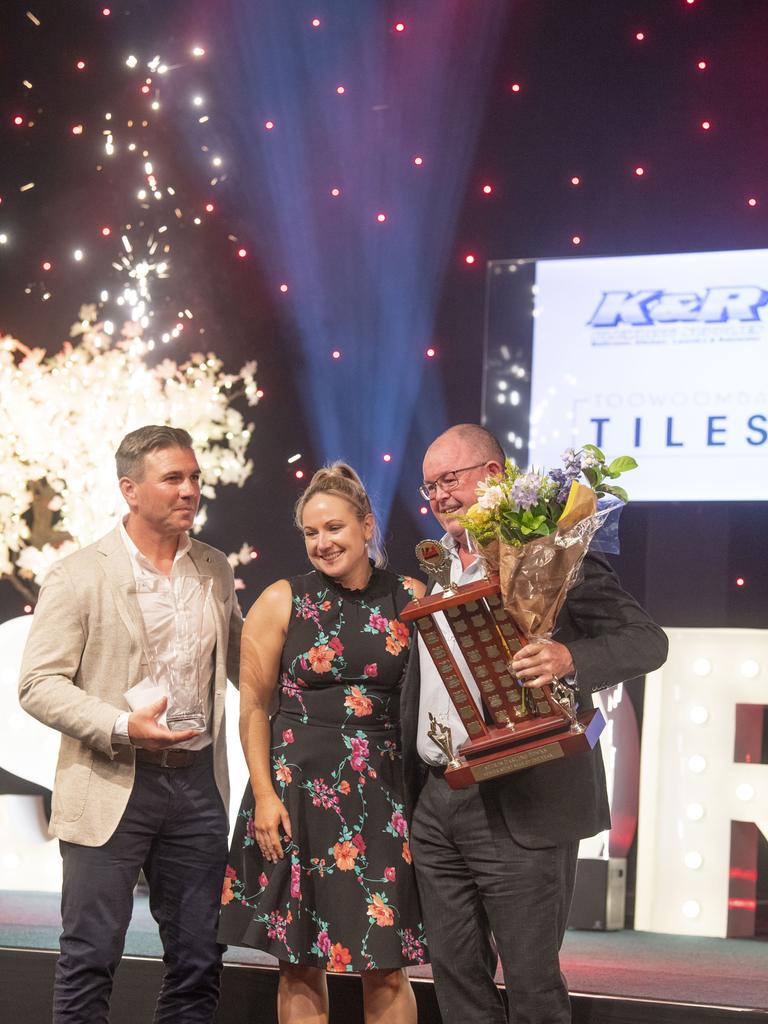 Jackie Gallagher accepts the Senior Sports Star of the Year award on behalf of Brielle Erbacher from David Maker, Toowoomba Tiles and Paul Reedy, K &amp; R Plumbing Supplies. Sports Darling Downs Sports Stars of the Year dinner. Saturday, February 11, 2023. Picture: Nev Madsen.