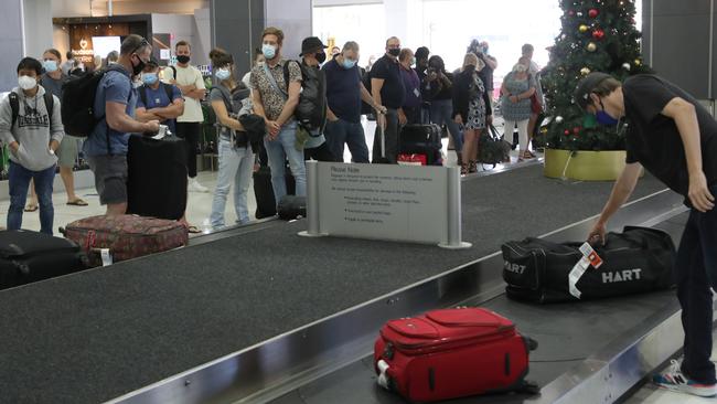 People arrive at Melbourne Airport from their Brisbane flights where a COVID lockdown has begun. Friday January 8, 2021. Picture: David Crosling