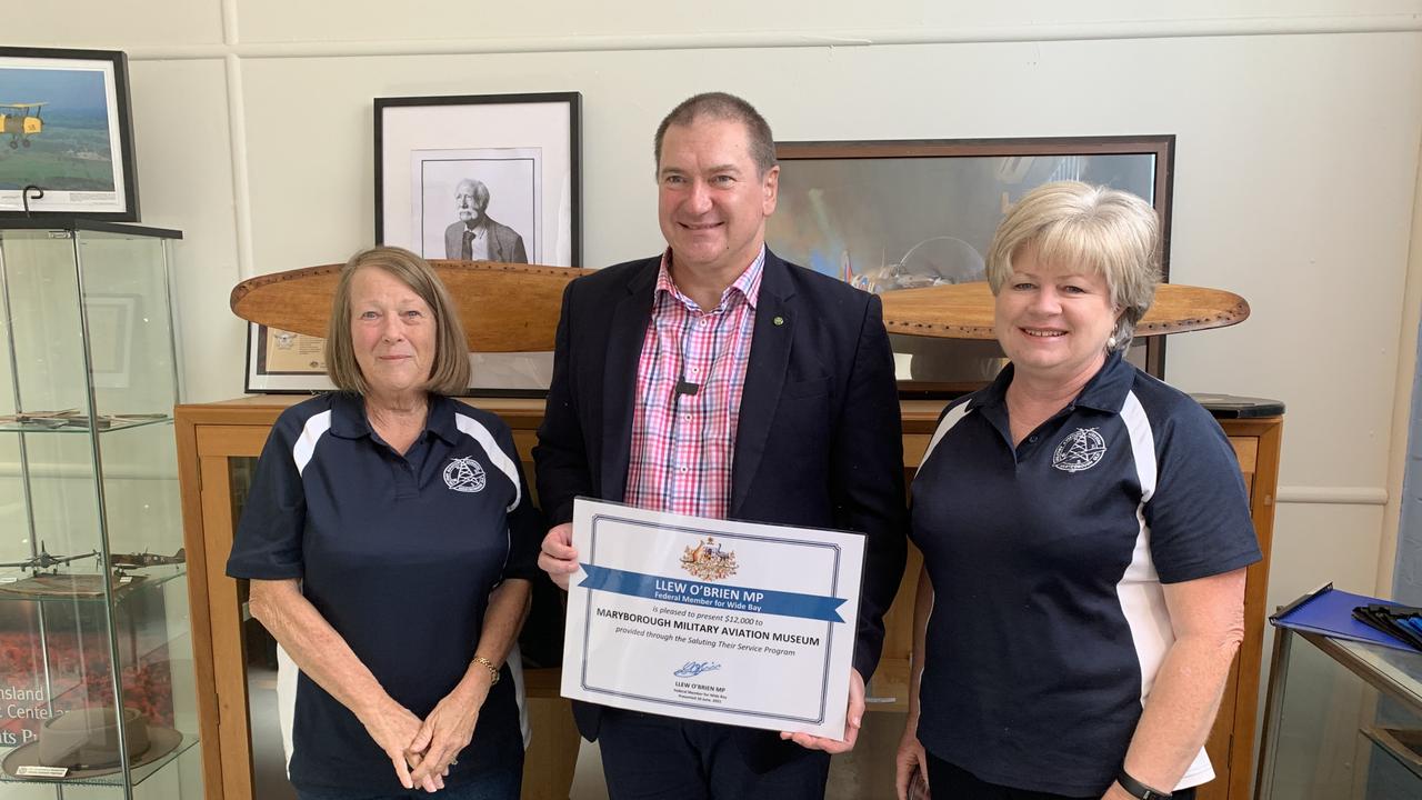 MP Llew O'Brien presents a $12,000 grant to the Maryborough Military Aviation Museum with (L) Museum association vice president Nan Ott and president Jenny Elliot. Photo: Stuart Fast