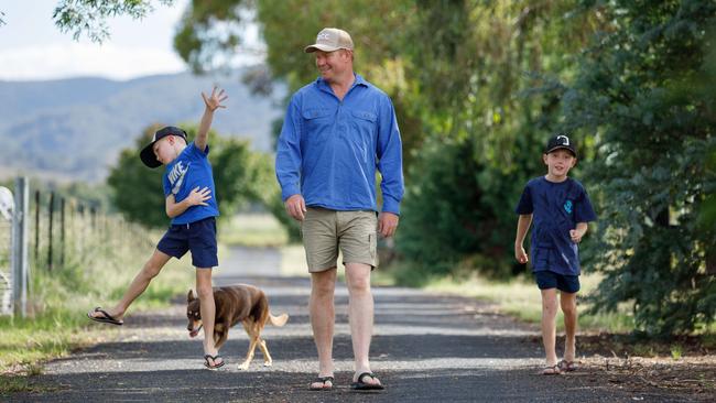 A relief: Mudgee electrician Daniel Stewart with sons Max, 5, Finn, 7, and dog Millie. Picture: Max Mason-Hubers