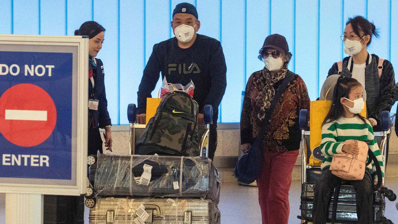 Passengers arrive at Los Angeles International Airport on Wednesday. Picture: Mark Ralston/AFP