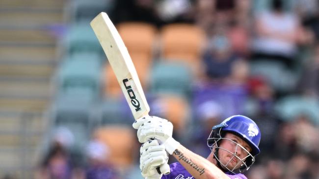 HOBART, AUSTRALIA – DECEMBER 24: D'Arcy Short of the Hurricanes hits a six during the Men's Big Bash League match between the Hobart Hurricanes and the Melbourne Stars at Blundstone Arena, on December 24, 2021, in Hobart, Australia. (Photo by Steve Bell/Getty Images)