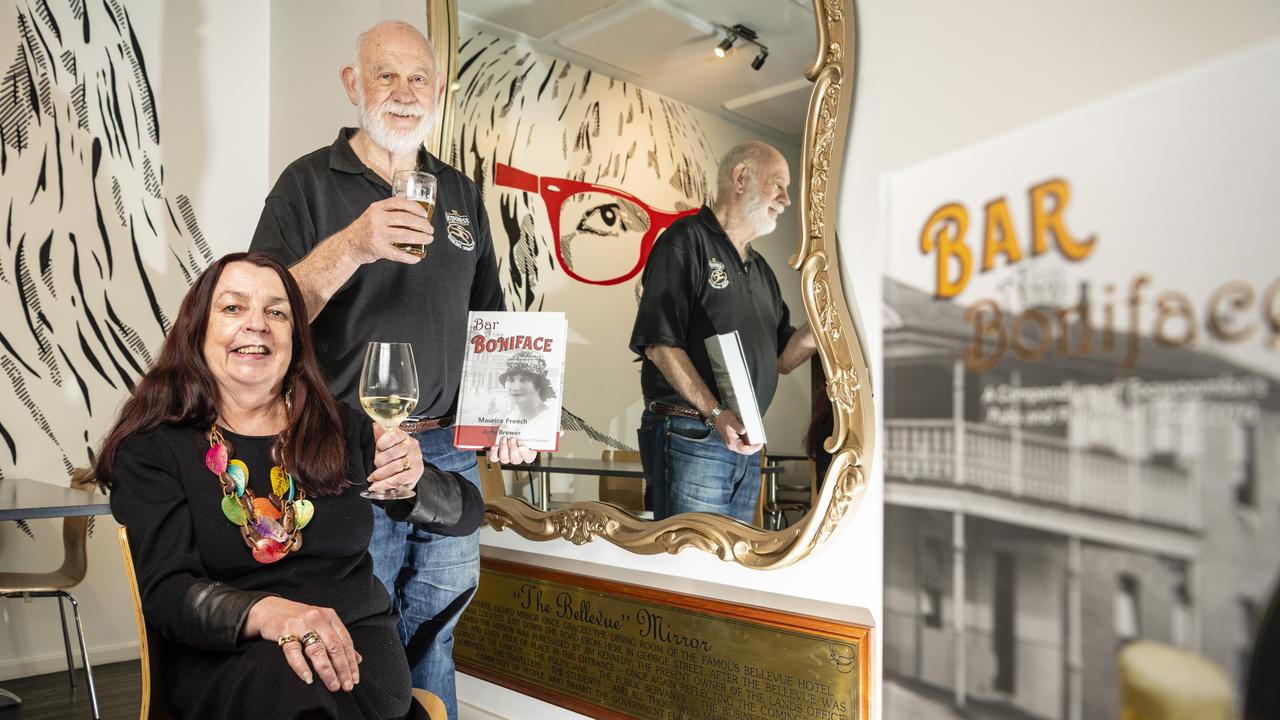 Bar and Boniface: A Compendium of Toowoombas Pubs and Publicans 1844-2020 co-authors Maurice French and Judy Brewer in front a mirror from the historic Brisbane Bellevue at the Stock Hotel, Monday, June 20, 2022. Picture: Kevin Farmer